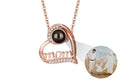 Rose gold necklace with 'mom' pendant and photo insert on a white background phote projection