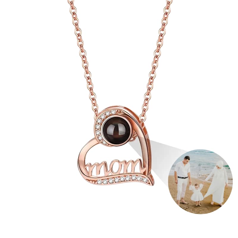 Rose gold necklace with 'mom' pendant and photo insert on a white background phote projection