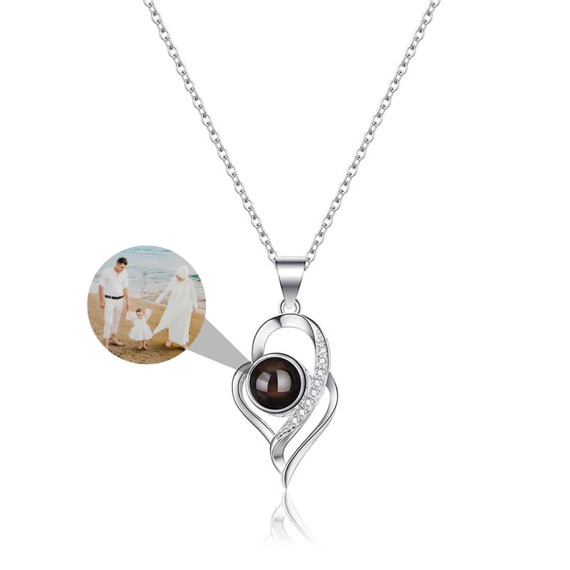 Silver phote projection necklace with a brown gemstone pendant on a white background 