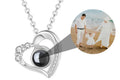 Heart-shaped necklace with a black gemstone and family photo inset