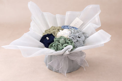 Front view of a hijab bouquet with multiple folded hijabs